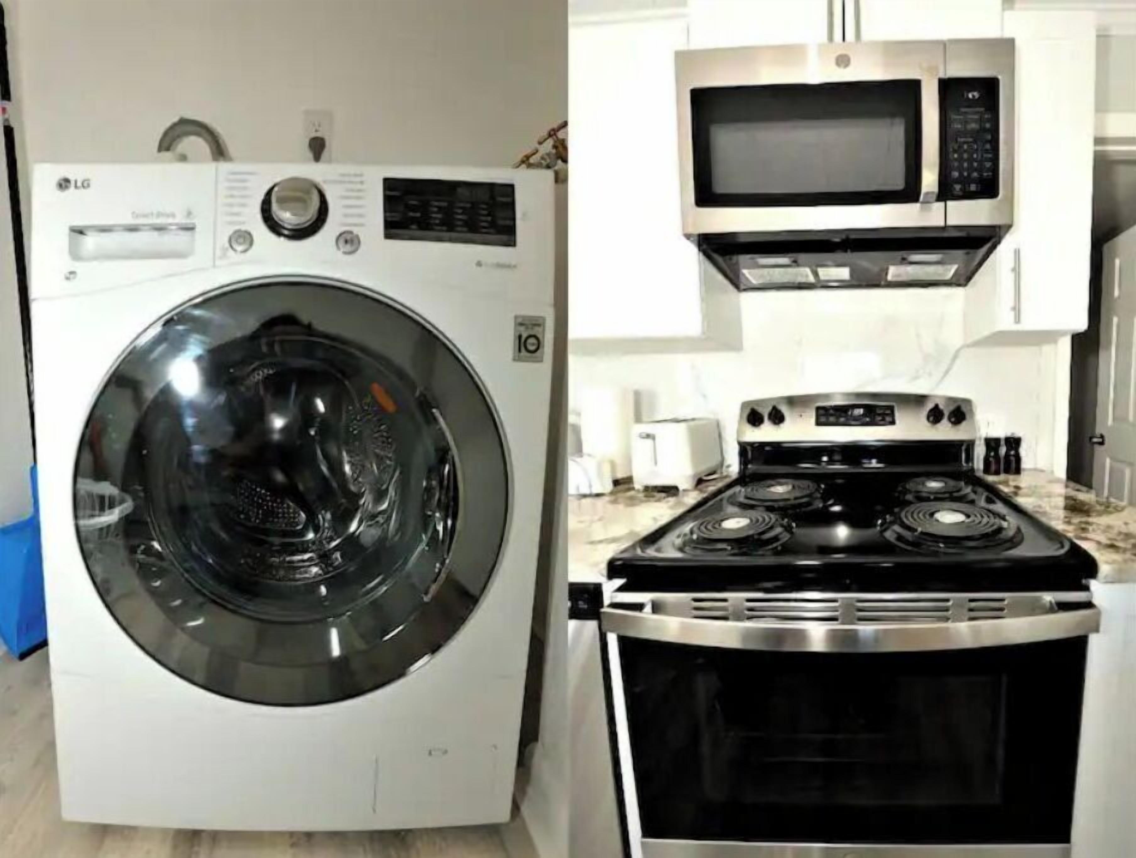 A compact kitchen with a microwave, stove, and washing machine.