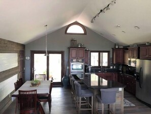 Enjoy cooking in this well-equipped kitchen with a central island and dining area.