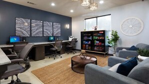 A modern office space with a desk area, multiple chairs, a vending machine, and a large window. - Total Relaxation and Tranquility - Perfect space for family or work . (The Woodlands)