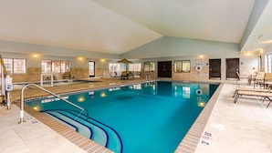An indoor swimming pool with clear lanes, a lifeguard chair, and a sunshade. - Pool and Hot Tub. Near University of North Dakota (Grand Forks)