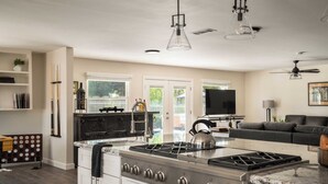 A modern kitchen with a central island, stainless steel appliances, and pendant lighting. - Private Temecula Wine Country Estate With Pool, Hot Tub, Mini Golf & Stunning Patio (Temecula)