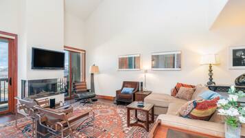 55-inch TV with digital channels, fireplace, streaming services