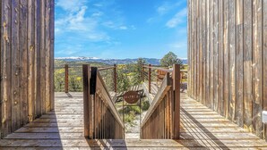 A wooden pathway leading to a scenic overlook with a sign indicating 'Zebble Lodge'. - Off-grid Masterpiece Cabin W/ Breathtaking View (Central City)