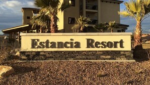 A building with a sign reading "Estancia Resort".