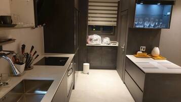 Full-size fridge, microwave, rice cooker, cookware/dishes/utensils