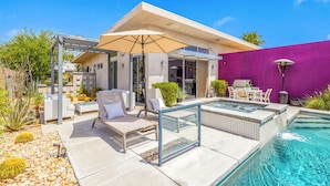 A modern outdoor pool area with lounge chairs, a pergola, and a patio with a grill. - Troubadour - Mid Mod Getaway (Palm Springs)