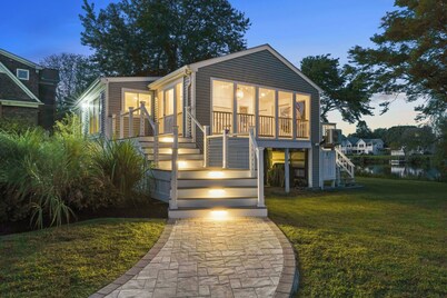 Stunning waterfront home with big yard & dock! Voted #1 rental in all of RI!