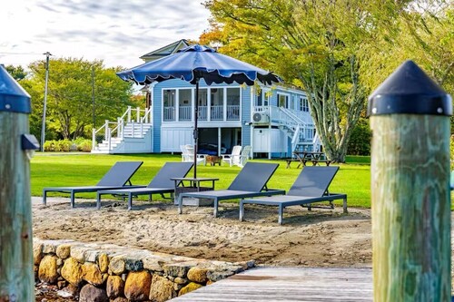 Stunning waterfront home with big yard & dock! Voted #1 rental in all of RI!