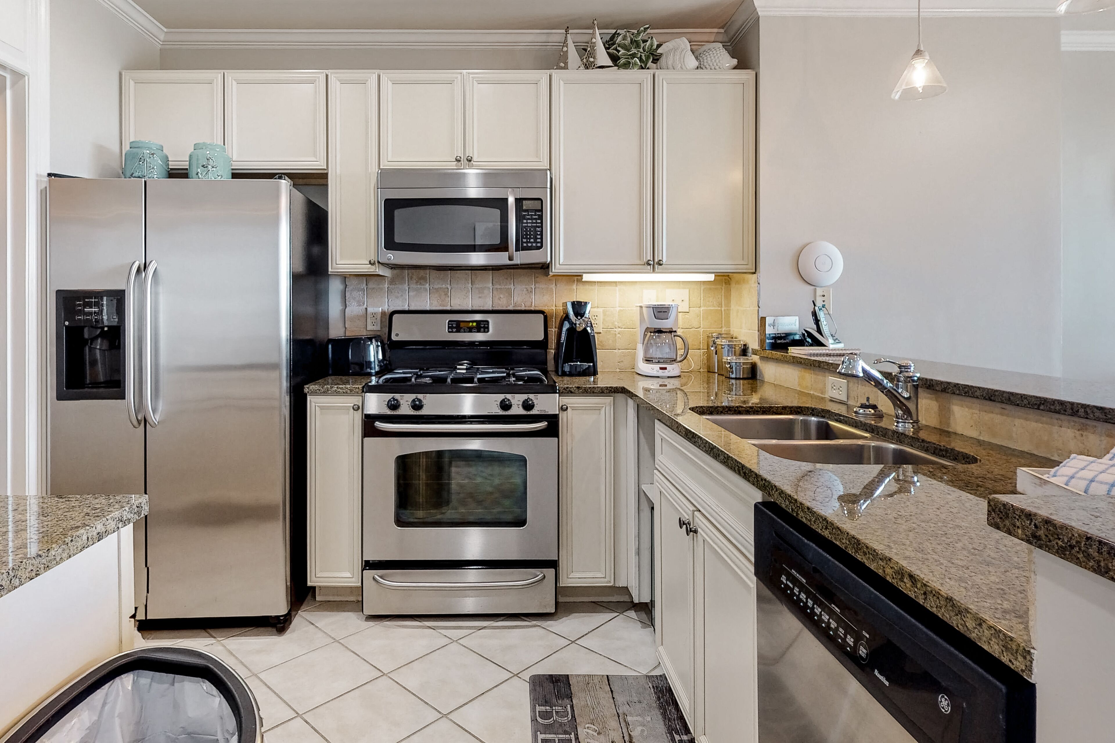 Water-view condo with balcony, pool, hot tub, gym, dining, & shops