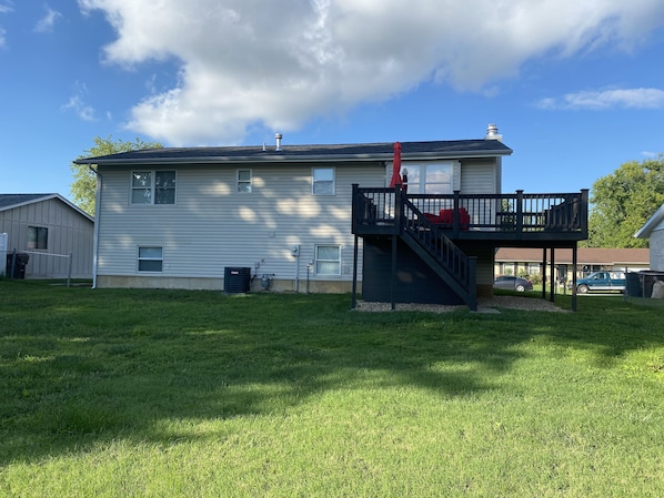 A two-story house with a covered patio and a small deck. - Dream Away Home Exclusive (St. Peters)