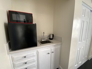 Fridge, microwave, electric kettle, cookware/dishes/utensils