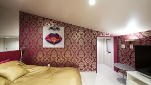 A bedroom with a large bed, a TV, and a mirror. - La Krasse Skytree (Tokyo)