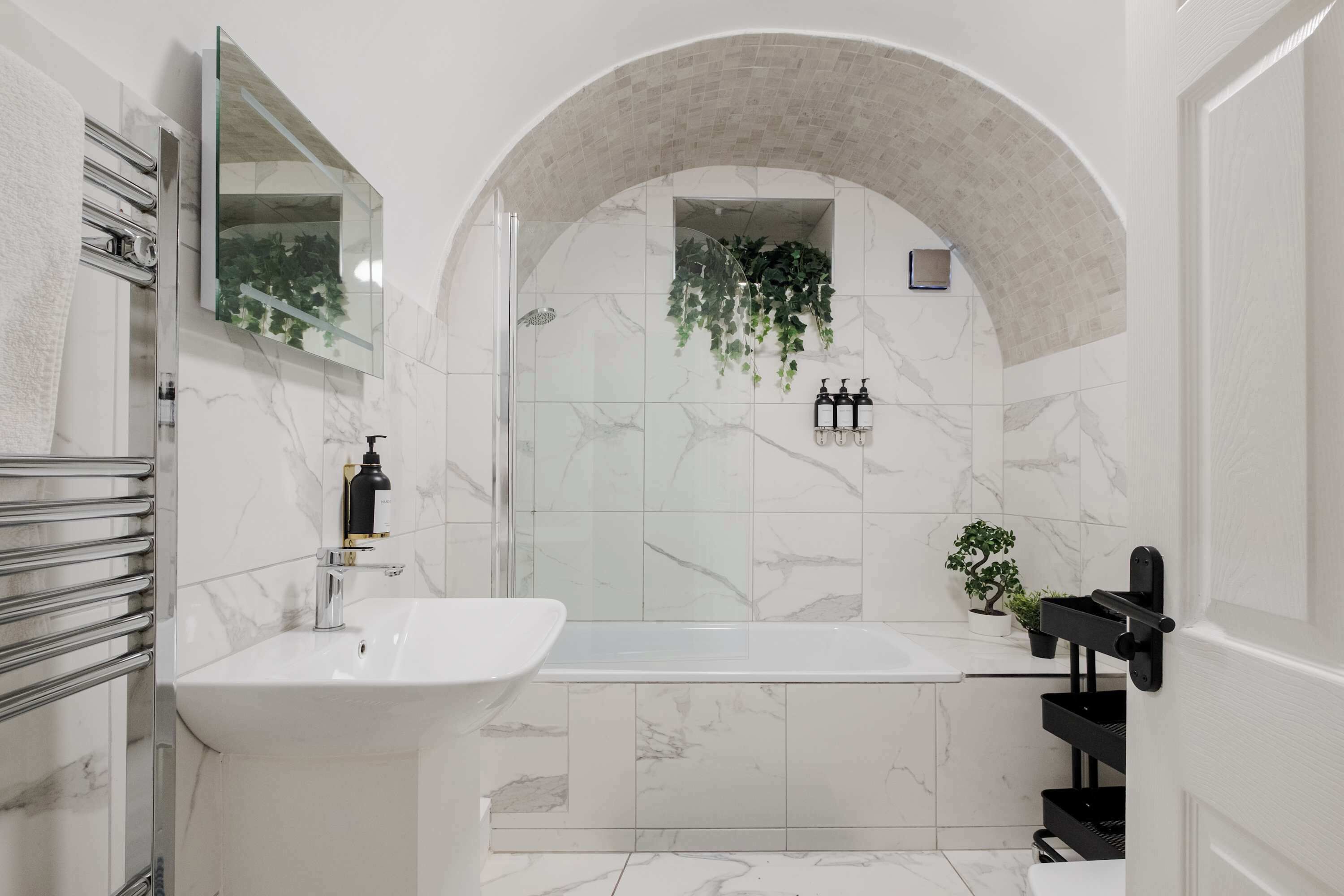 Bathtub, eco-friendly toiletries, hair dryer, towels
