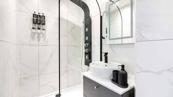 Bathtub, eco-friendly toiletries, hair dryer, bidet