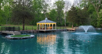 Outdoor Oasis with pickleball, swimming pond, basketball, shuffleboard & pavilion with kitchen