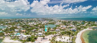 Beach House is a stunning and spacious 2bed/2bath with private pool & steps to Sombrero Beach!