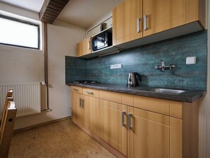 Fridge, microwave, cookware/dishes/utensils