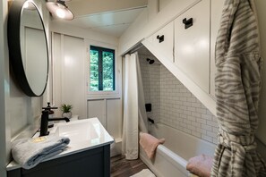 Bathtub, hair dryer, towels