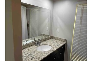 Combined shower/bathtub, hair dryer, towels, soap
