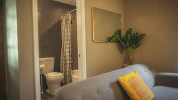 Bathtub, hair dryer, towels, soap