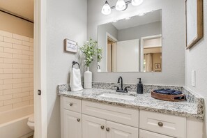 Combined shower/tub, hair dryer, towels, soap
