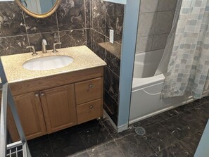 Combined shower/bathtub