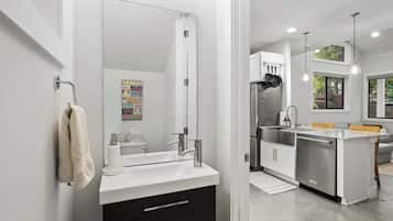 Combined shower/tub, hair dryer, towels, soap