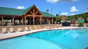 A swimming pool with lounge chairs and a covered pavilion. - Gorgeous Golf Views, Quiet/Large, Resort and Pools (Reeds Spring)
