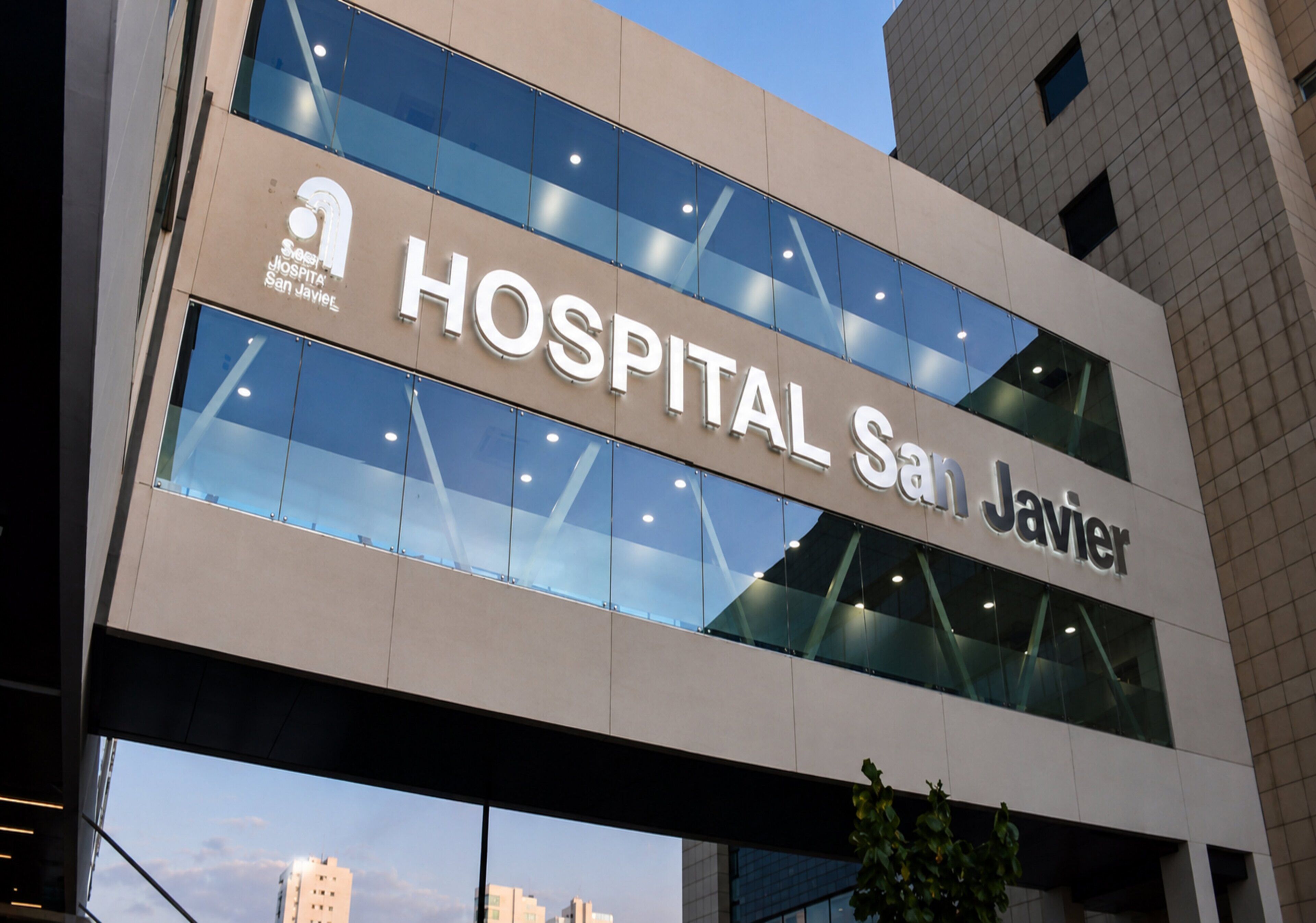 A modern building with a sign that reads 'Hospital San Javier.'