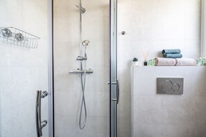 Shower, hair dryer, towels, soap