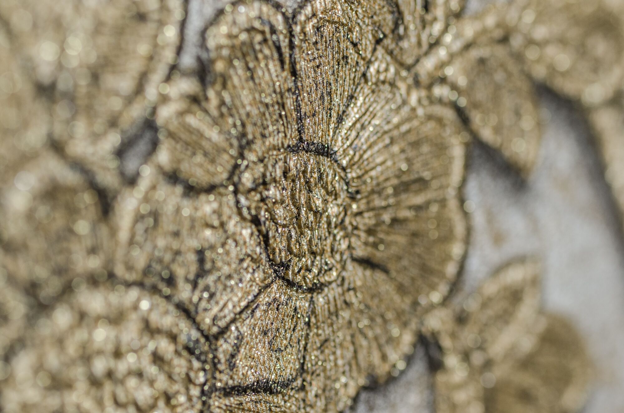 A close-up of a textured fabric with a floral pattern.