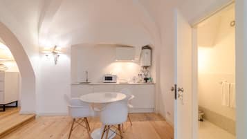 Studio | Private kitchen | Fridge, microwave, electric kettle, highchair