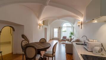 Superior Apartment | Private kitchen | Fridge, microwave, electric kettle, highchair