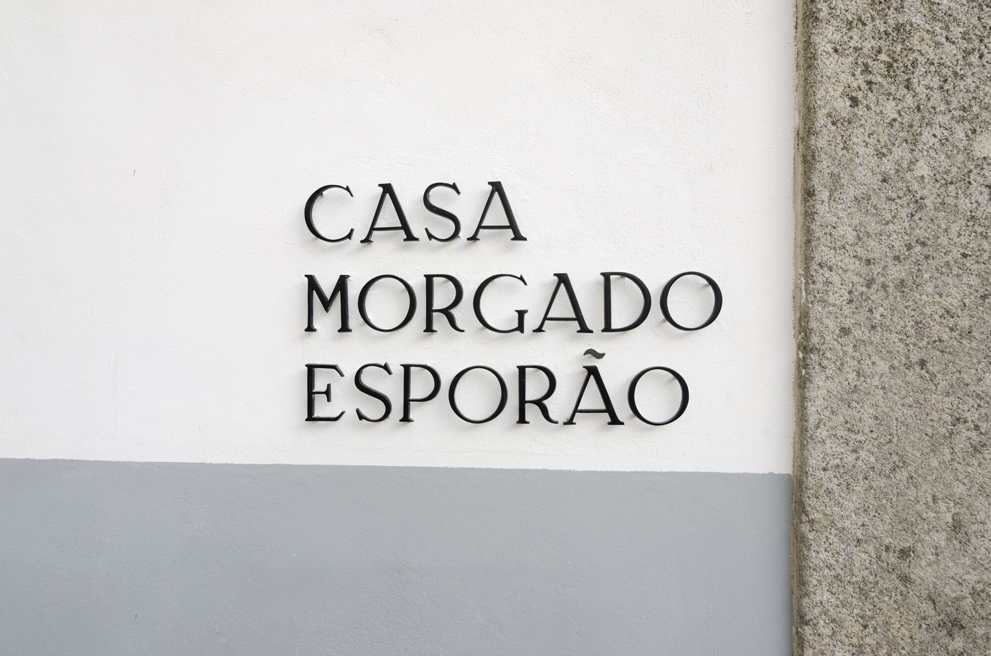 A sign with the text 'CASA MORGADO ESPORÃO' indicating the name of a hotel or property.