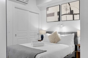 1 bedroom, desk, iron/ironing board, travel crib