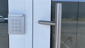 A door with a keypad lock and a metallic handle. - Erft Apartment (Kerpen)