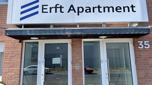 A building with a sign reading "Erft Apartment" and the number 35. - Erft Apartment (Kerpen)