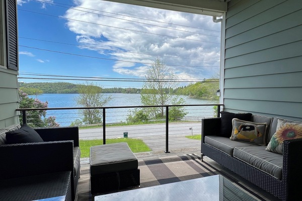 covered breezeway with lake views; propane grill