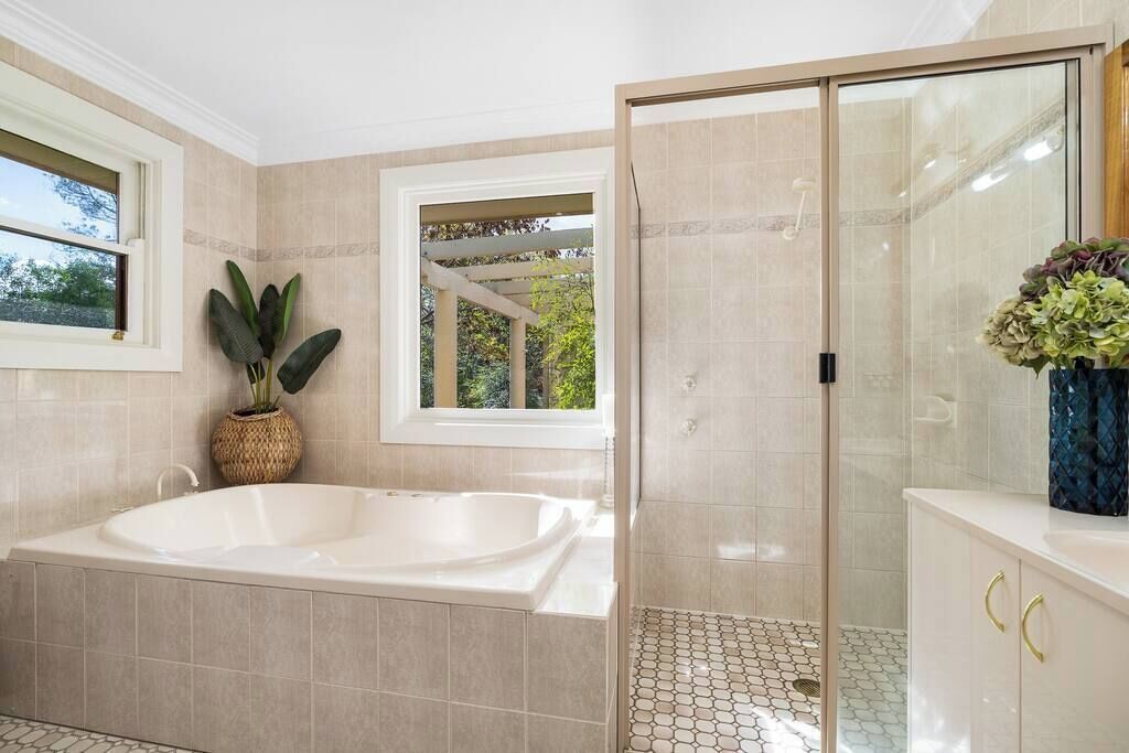 Bathtub, hair dryer, towels, shampoo