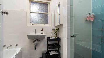 Bathtub, hair dryer, towels