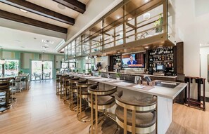 Relax and socialize in our bar area with a long counter, TV, and comfortable seating.
