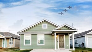 A single-story house with a front porch and a garage.