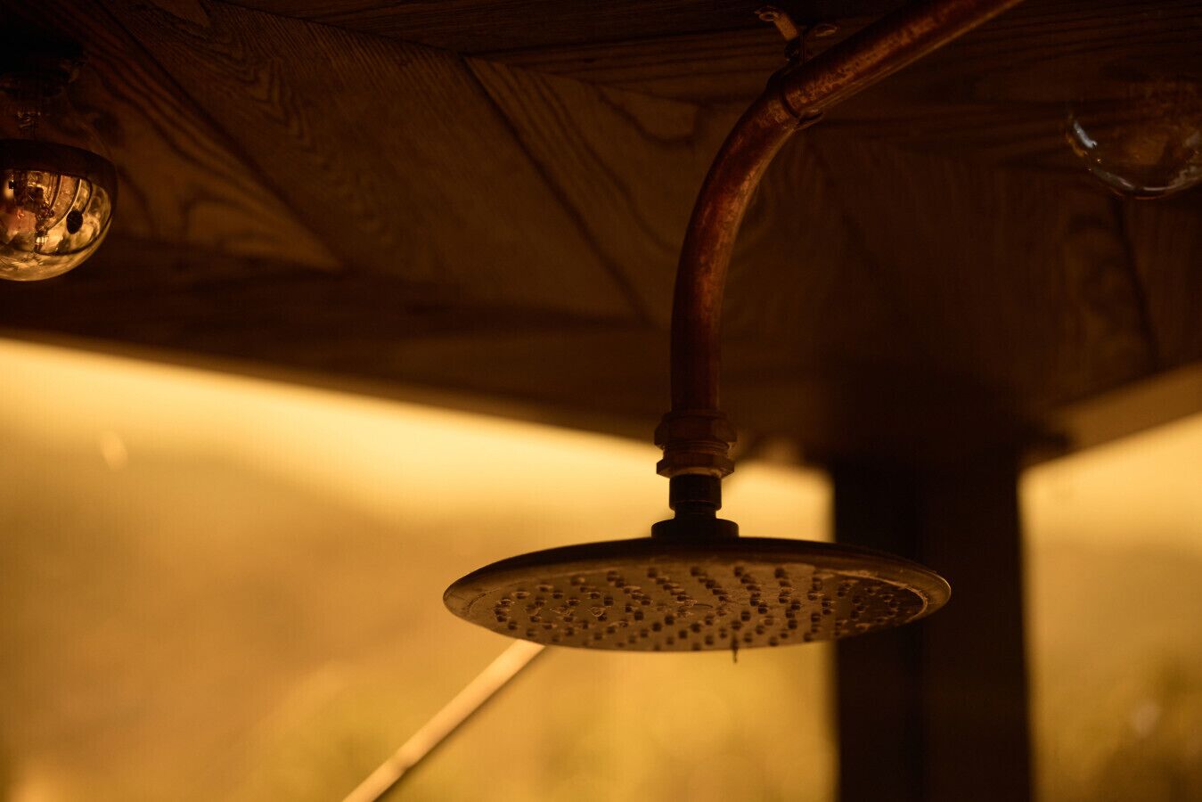 A showerhead with a visible water stream.