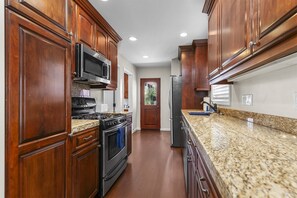 Fridge, microwave, oven, stovetop - OB Cottage • Pet-Friendly w/ Yard, Walk to Beach + A/C (San Diego)