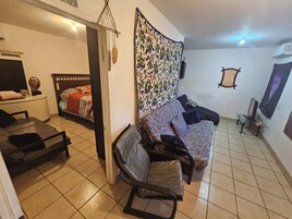 Queen Apartment with kitchenette | Living area | 50-inch LCD TV with digital channels, TV