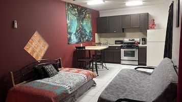 Deluxe Apartment, 1 Bedroom, Kitchenette, Ground Floor | Living area | 50-inch LCD TV with digital channels, TV