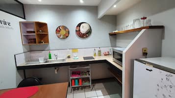 Fridge, microwave, stovetop, coffee/tea maker