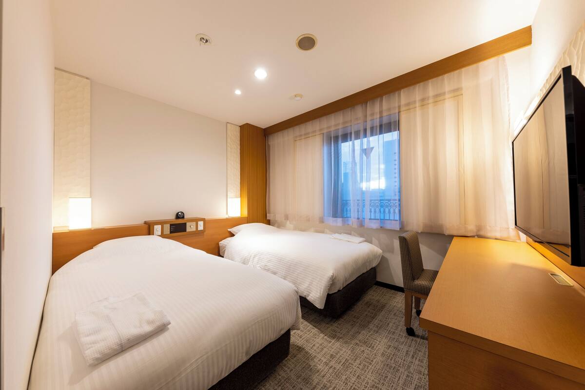 Twin Room, Smoking | Down comforters, desk, WiFi (free), bed sheets