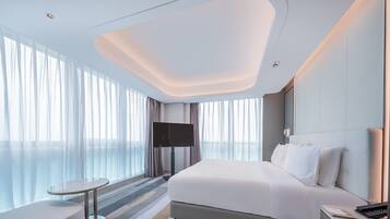 Deluxe Suite, 1 Bedroom | Down comforters, desk, laptop workspace, blackout drapes
