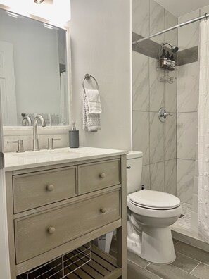 Shower, towels, soap, toilet paper